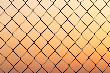 Fototapeta premium metal grid at sunset