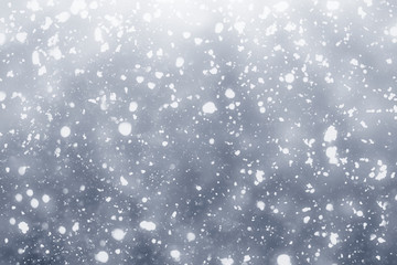 Snowflakes rays and bokeh or glitter lights on silver background. Christmas abstract template