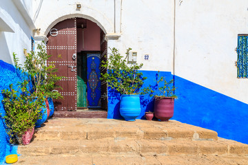 Entrance of  a house in the small streets in blue and white in t
