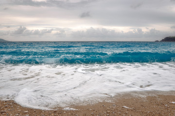 Fototapeta na wymiar Sea beach waves. Close-up view. 