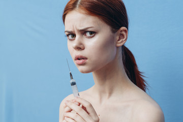 Obraz premium woman with a syringe, injection, beauty, botox