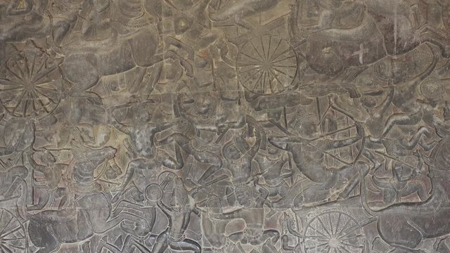 Bas-relief stone carving around Angkor Wat castle, Cambodia, 4k
