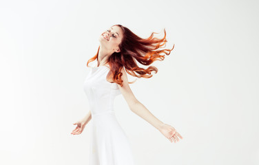 Naklejka premium red-haired woman in a light dress, lightness