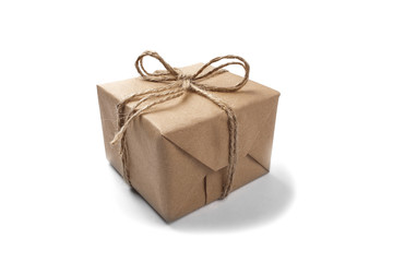 Box with a gift wrapped in Kraft paper on isolated white backgro