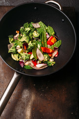 Cooking Asian wok with stir fry chicken and vegetables Chinese food Top view