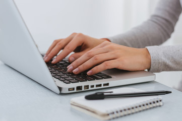 Fototapeta na wymiar Businesswoman hand working with new modern computer and writing