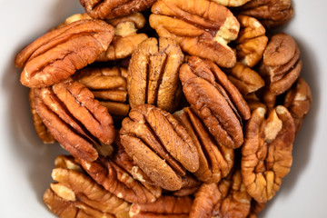 Pecan Nuts In White Bowl On Table