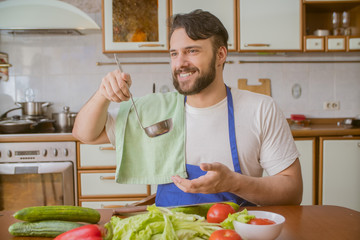 a man cooks in the kitchen