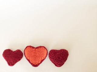 Background Valentine's day with hearts handmade from wool