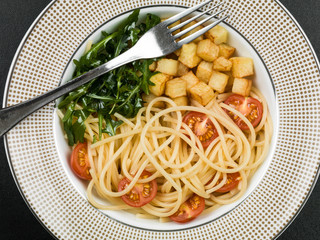 Spaghetti with Cherry Tomatoes Potatoes and Rocket Leaves