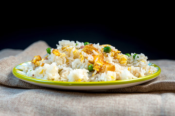 Homemade Chinese fried rice with vegetables and fried eggs