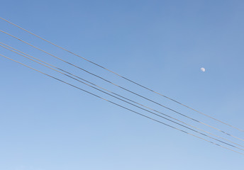 electrical wire against the bkue sky.