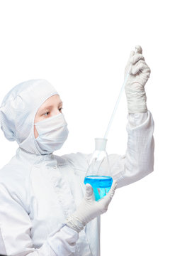 Chemist with the flask and pipette analyze blue liquid substance