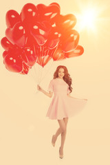 Beautiful girl, stylish fashion model with balloons in the shape