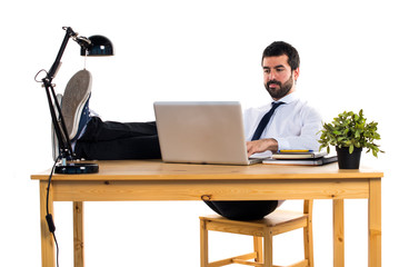 Businessman working with laptot in his office