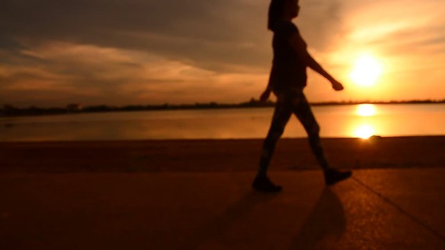 Blur Silhouettes People Walking and Running  Sunset