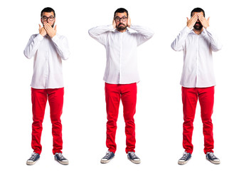 Handsome man with glasses covering his ears