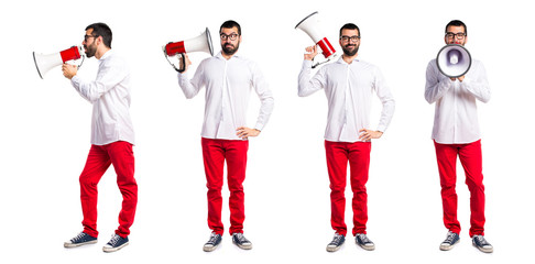 Handsome man with glasses shouting by megaphone