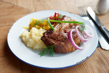 Grilled pork ribs with sauerkraut and mashed potatoes