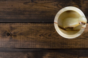 onyx Mortar and Pestle on wooden Background