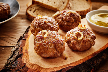 Freshly cooked meatballs on rustic table