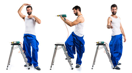 Young electrical technician with a drill