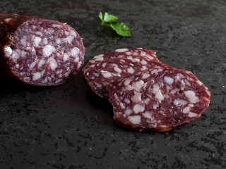 sausage on dark stone