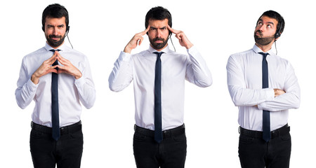 Young man with a headset thinking