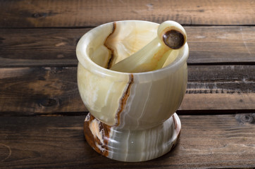 onyx Mortar and Pestle on wooden Background