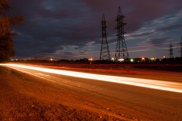 Night landscape, the road on which vehicles travel.