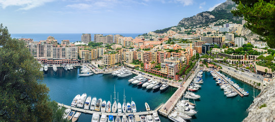 Monte Carlo harbour city panorama. View of luxury yachts and apa - obrazy, fototapety, plakaty
