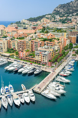 Monte Carlo harbour city panorama. View of luxury yachts and apartments in harbor of Monaco