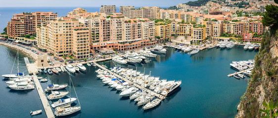 Monte Carlo harbour city panorama. View of luxury yachts and apartments in harbor of Monaco