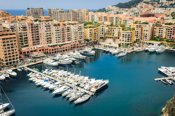 Fototapeta na wymiar Monte Carlo harbour city panorama. View of luxury yachts and apartments in harbor of Monaco