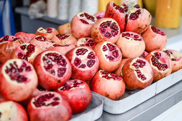 pile of cut open pomegranate