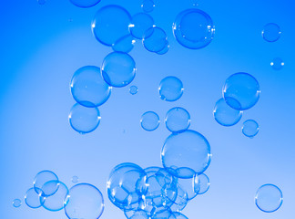 Soap bubbles blue abstract background