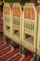 Vintage Wooden chairs in details with table on porch of country house
