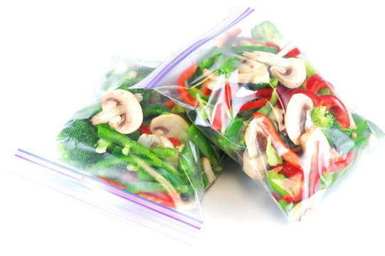 fresh chopped salad vegetable in plastic food bag