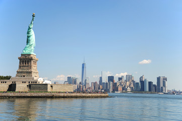 Statue of Liberty on the island and New York Manhattan skyline