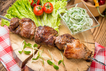 Delicious juicy skewered meat or shish kebabs on skewers of pork tenderloin. Fragrant and spicy dish.