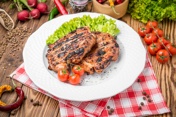 roasted chicken with herbs served on a plate with vegetables