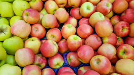 Group of fresh organic apples in a marketplace