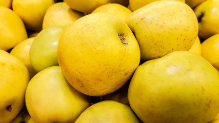 Group of fresh organic apples in a marketplace