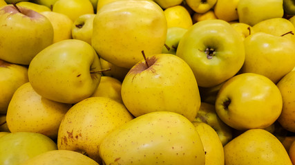 Group of fresh organic apples in a marketplace