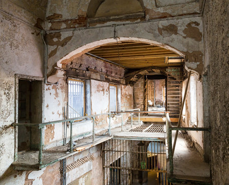 Old prison corridor with grunge metal staircase