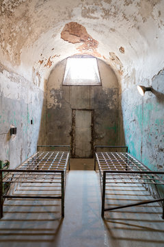 Grunge prison cell with sunlight window