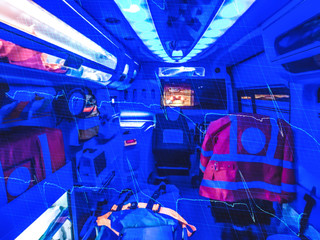 Double exposure of an ambulance  and ECG by night. Out of focus..