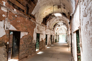 Fototapeta na wymiar Old prison corridor with open cells.
