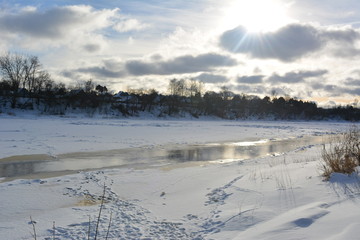 beautiful winter landscape: the sun over the river, nature