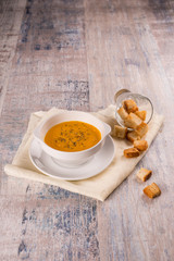 Pumpkin soup in a white plate